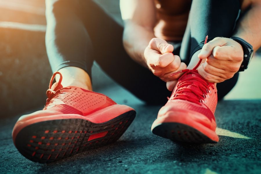 Sporting activities - someone putting on trainers