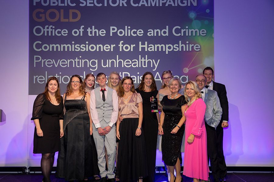 Youth Commission members and OPCC officers pick up their CIPR PRide gold award on stage