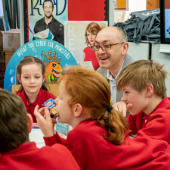 Assistant Police and Crime Commissioner Enzo Riglia talking with some of the Cyber Ambassadors