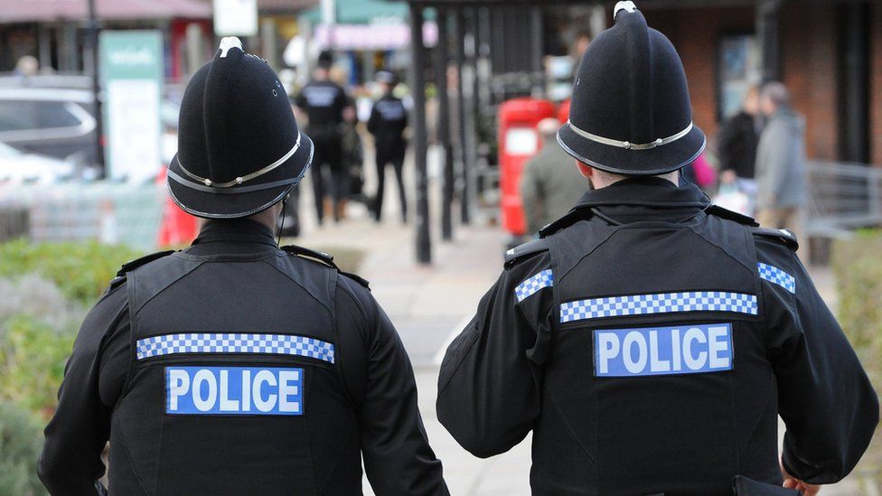 Police Officers walking away