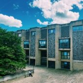 Winchester Crown court with trees and a blue sky