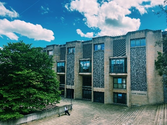 Winchester Crown court with trees and a blue sky