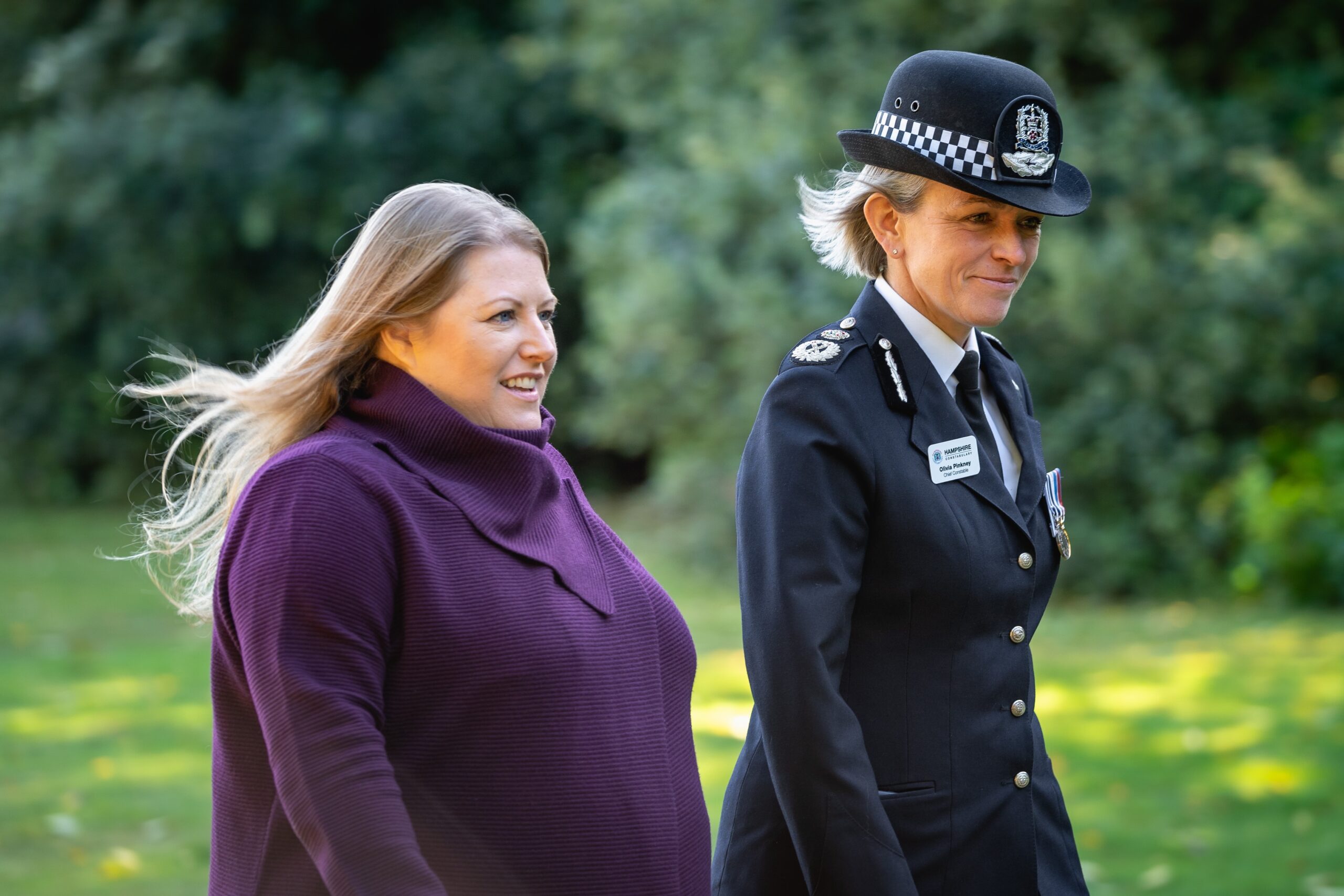 Donna jones walking with Olivia Pinkney, looking happy