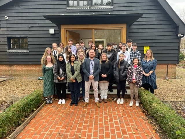 The youth commission standing with the PCC and Deputy PCC outside the barn office. Everyone looks happy.