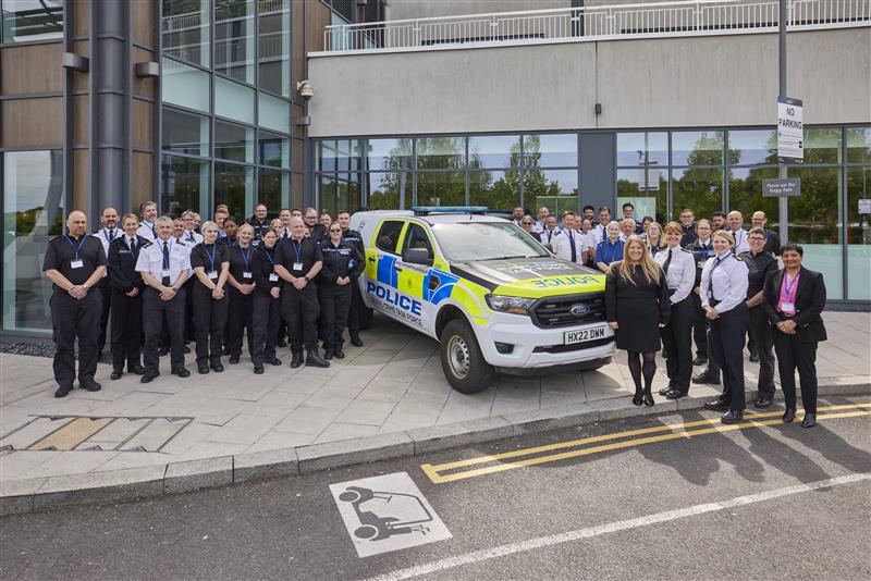 A group of uniformed police officers standing with a new Rural Crime Taskforce car and the PCC