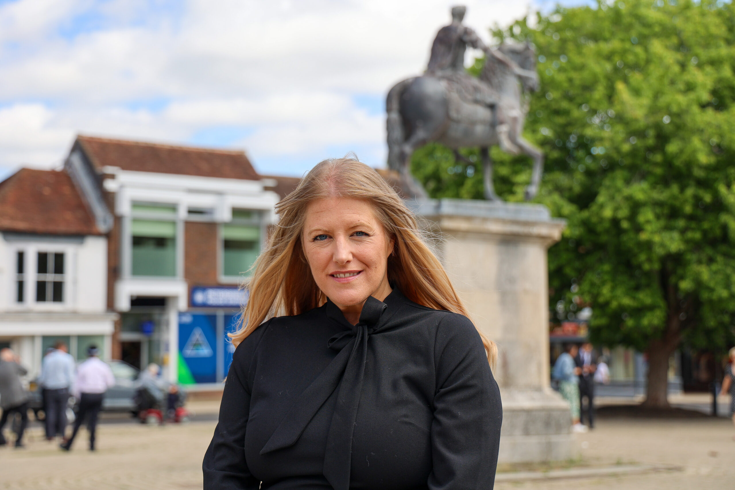 PCC Donna Jones outside Petersfield Police Station in a black dress