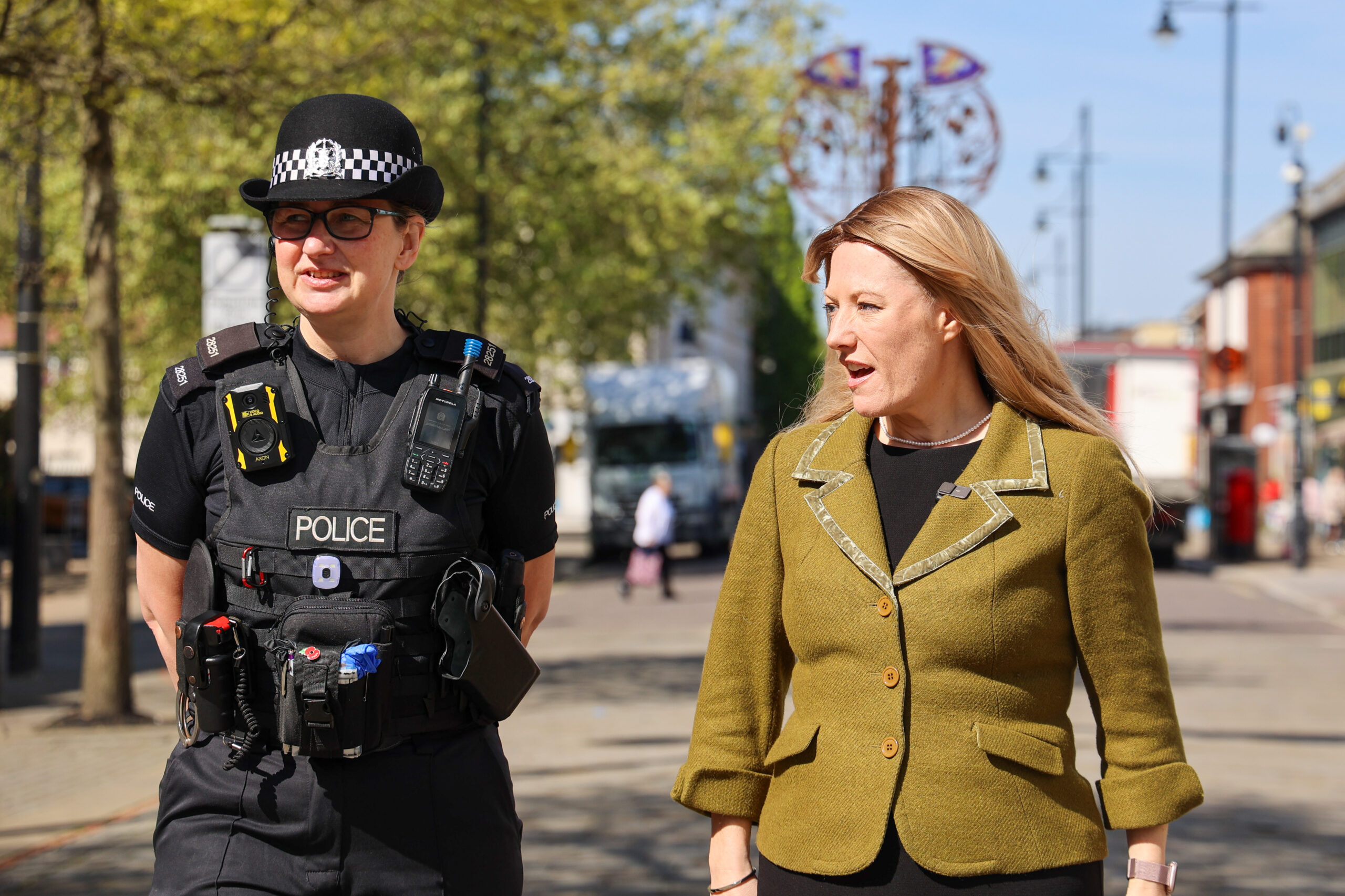 PCC Donna Jones on patrol with a police officer on sunny day in a high street