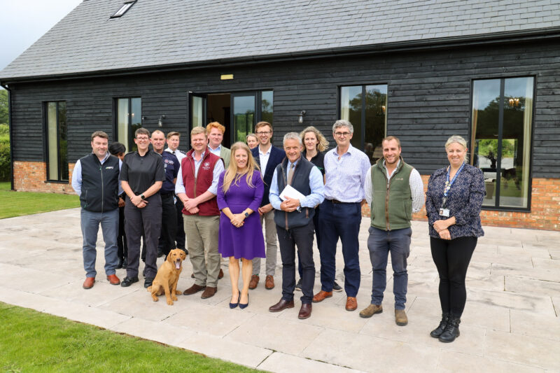 PCC Donna Jones stood outside a farm barn surrounded by attendees of a Rural Crime Meeting at Southwick Estate.