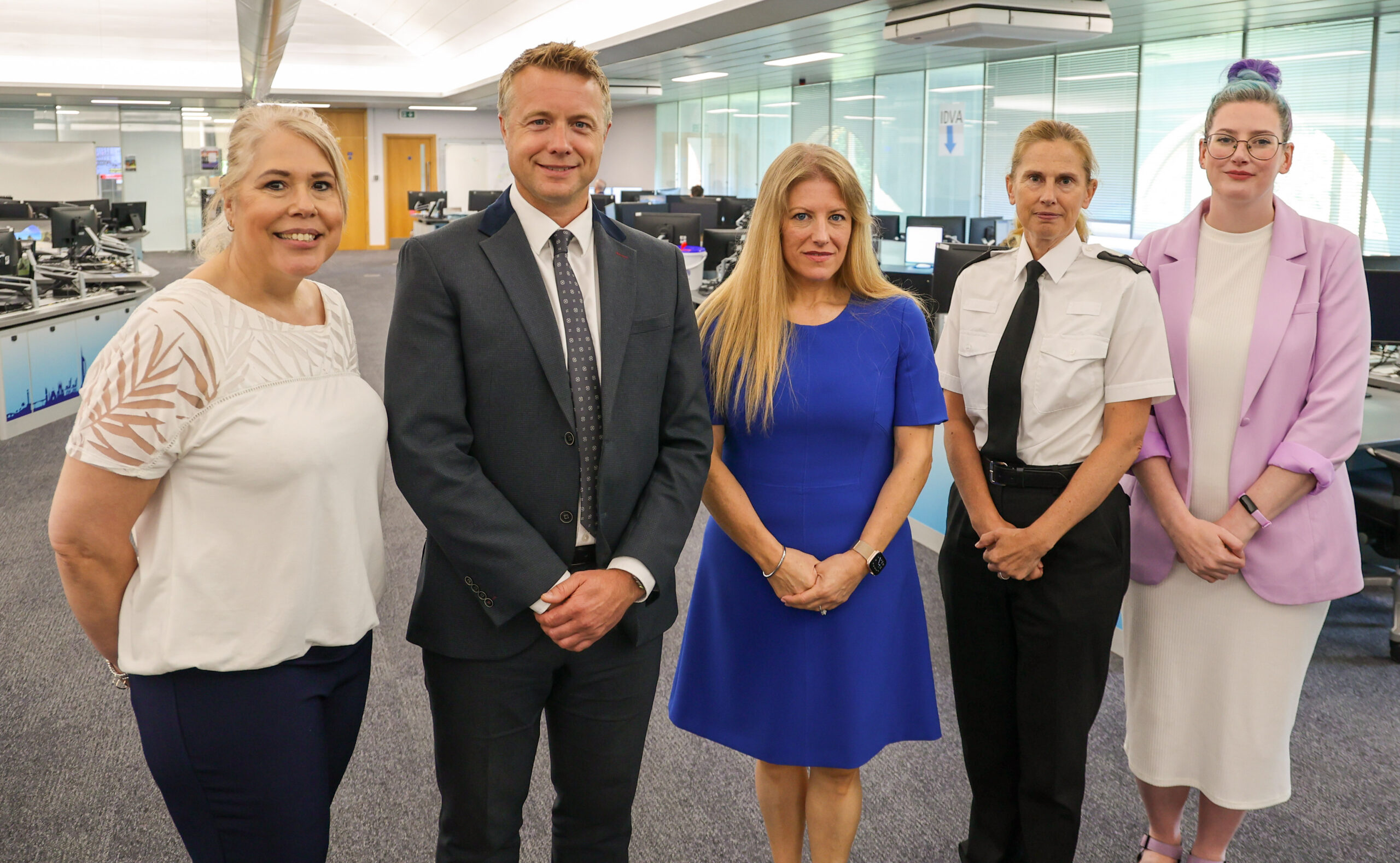 Rachel Pinnell (PCR Deputy Op's Manager), DCI Alex Spratt, PCC Donna Jones, Chief Supt Clare Knibbs, Czarina Jacobs (Stop Domestic Abuse Op's Manager) in the police control room.
