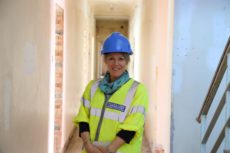 PCC Donna Jones in a hard hat and hi vis in a new police station mid-construction