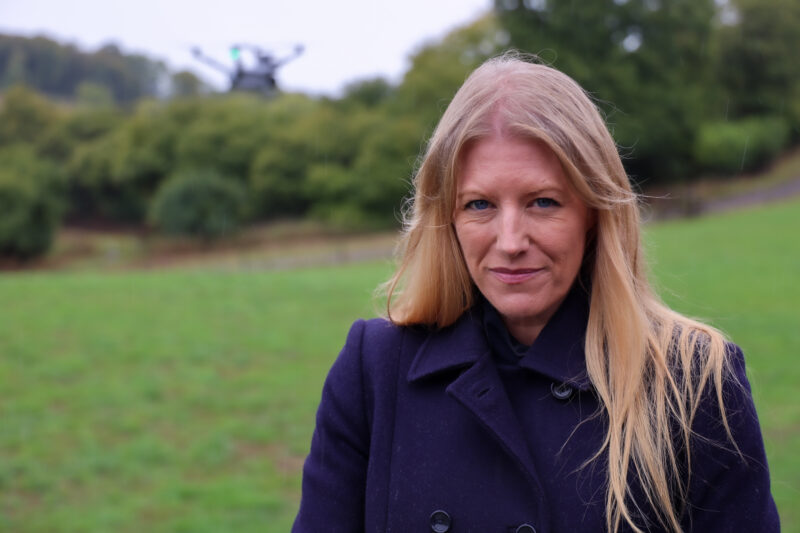 Donna Jones stood in a field in a blue coat